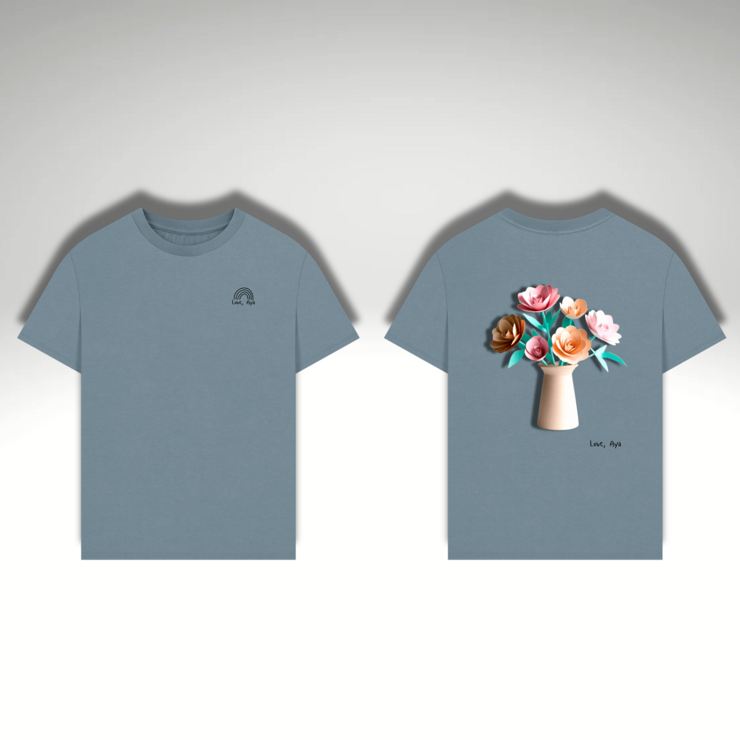 A flat image of the Men’s Oversized T-Shirt in Stone Blue with the “Love, Aya” logo on the left chest which features a black rainbow. Alongside it is the back of the product which features a large image of paper origami flowers in a vase.