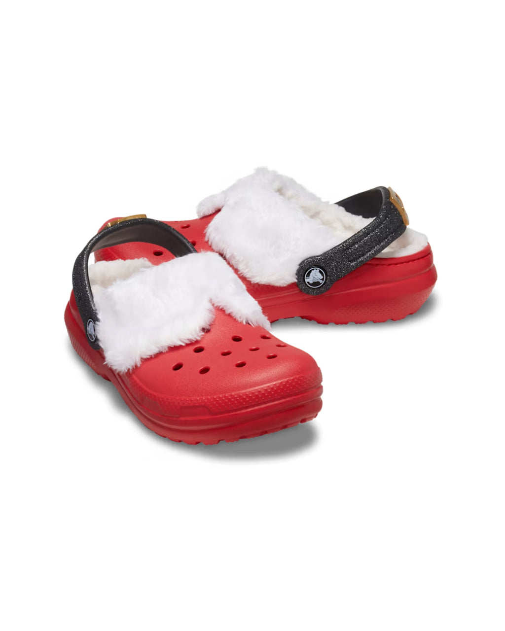Angled product shot of the Kids Classic Lined Santa Clogs with red uppers, white fluffy lining, and black glitter heel straps.