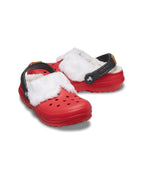 Angled product shot of the Kids Classic Lined Santa Clogs with red uppers, white fluffy lining, and black glitter heel straps.