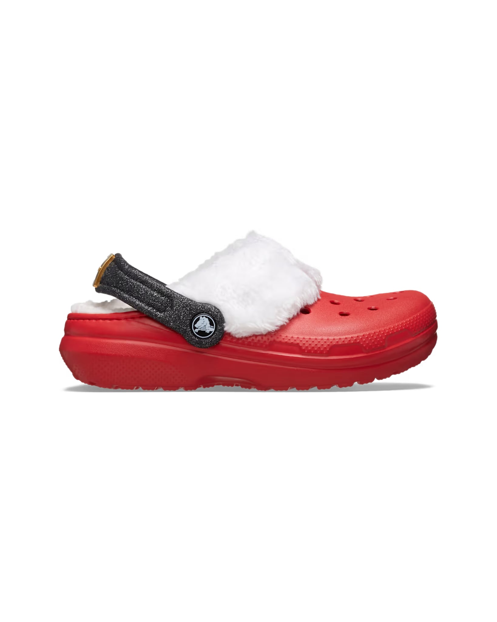 Side profile of the Kids Classic Lined Santa Clog, showing the red sole, white fleece collar, and black glitter heel strap.